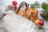 Millie Lottie Etta Food & Picnic Tote, Large, Natural Canvas on table surrounded by fruit