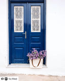 Etta Market & Picnic Tote, Large, carrying lylacs in front of blue door in Greece