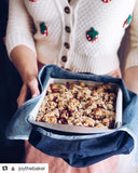 Joy the Baker using Millie Lottie Heirloom Wrap to carry her dessert